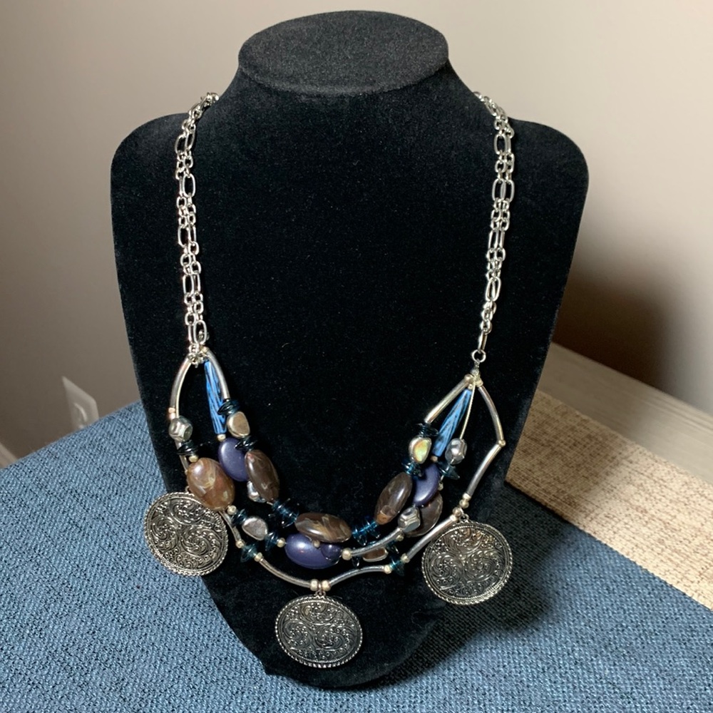 Silver beaded necklace.